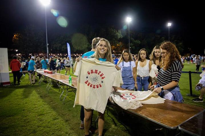 A student shows off the Campus Ruckus 2019 t-shirt.