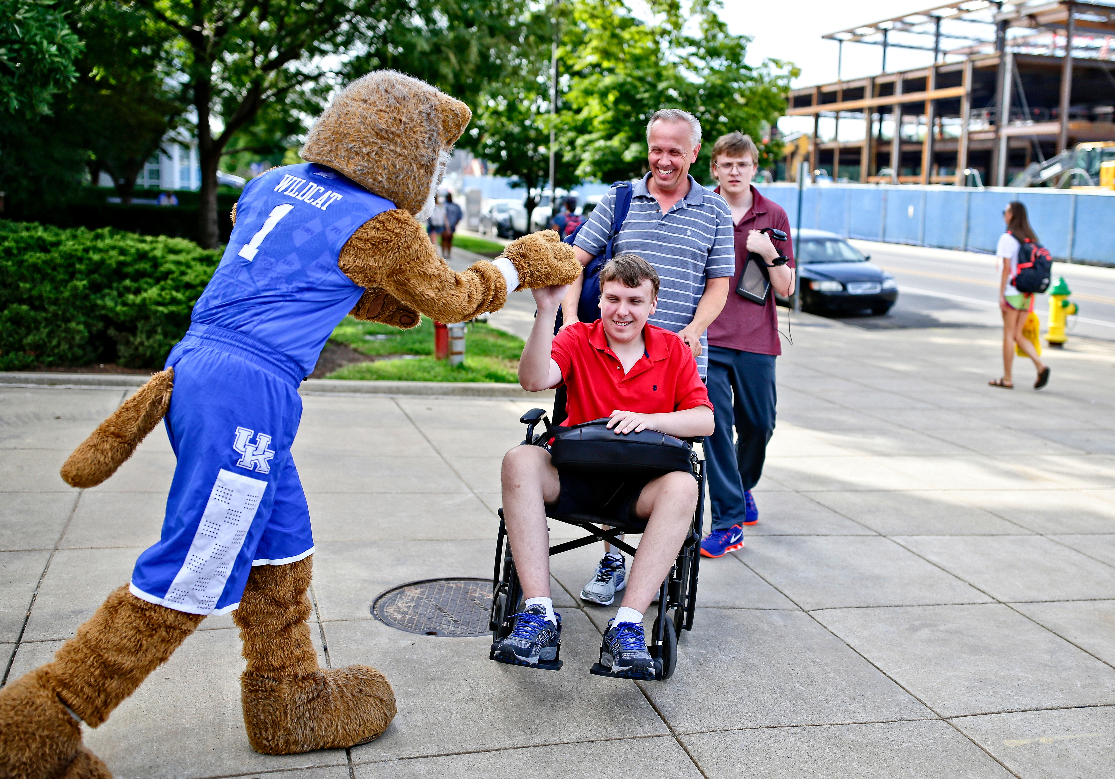 student in wheelchair with wildcat