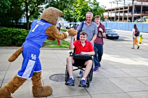 student in wheelchair with wildcat