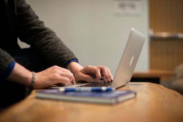 Person typing on a laptop