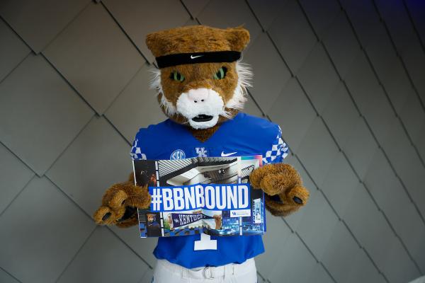 Wildcat mascot holding a  BBNBOUND poster
