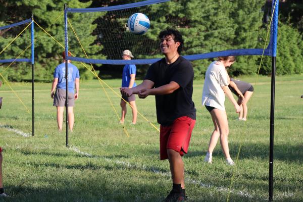 Student playing grass volleyball in a one day intramural sport event