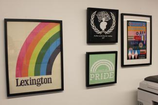 A series of wall art and archived t-shirts from projects of the Office of LGBTQ* Resources. 