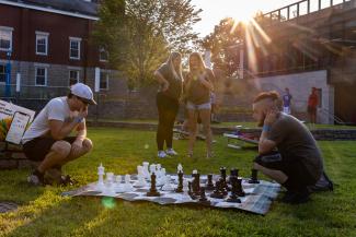 Students playing chess outside at Cat-A-Palooza, an event during K Week