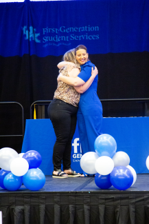 Student and Pinner Hugging