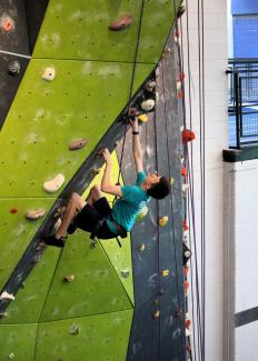4H participant climbing the wall