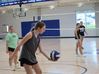 4H participant playing volleyball