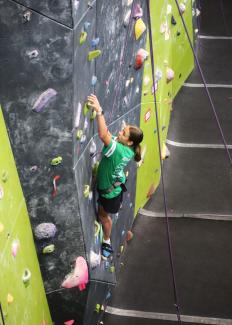 4H participant climbing wall