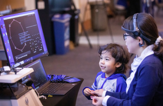 child experiencing curiosity fair