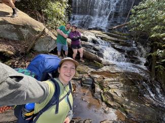 Leah's selfie with friends in front of a waterfall