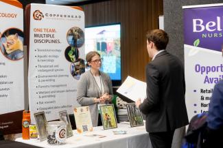 Student at career fair talking to a recruiter