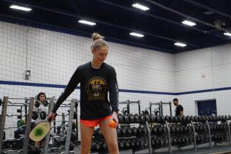 Student playing pickleball 