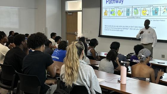 CARES Advisor leading a group advising session for first year students.