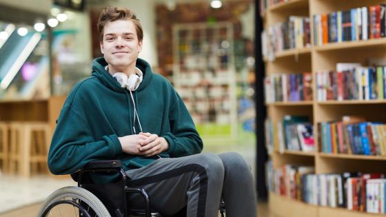 Man smiles in library