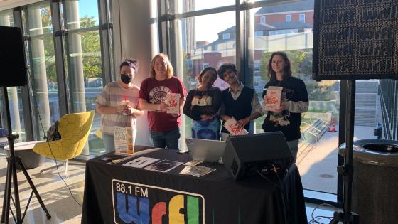 WRFL students at a table in the student center