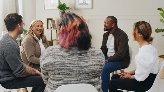 A group of people talking with each other