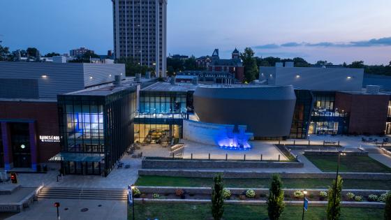 Gatton Student Center drone shot with blue lights at dusk