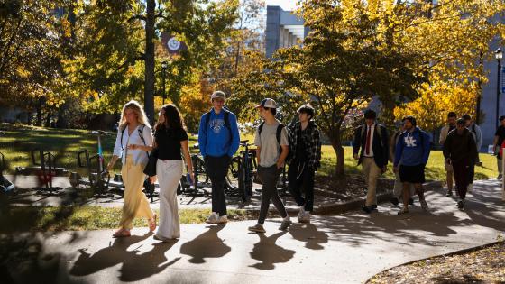 Students Walking to and from class in the warm Fall sunlight.