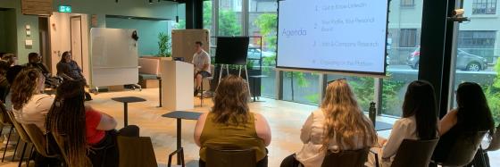 Explore First students participate in a discussion and presentation.