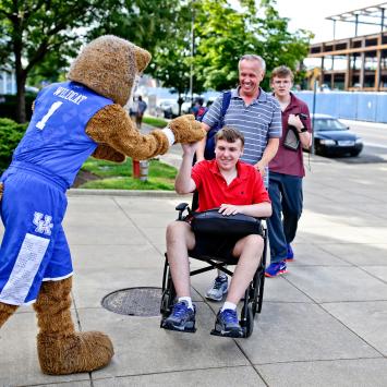 student in wheelchair with wildcat