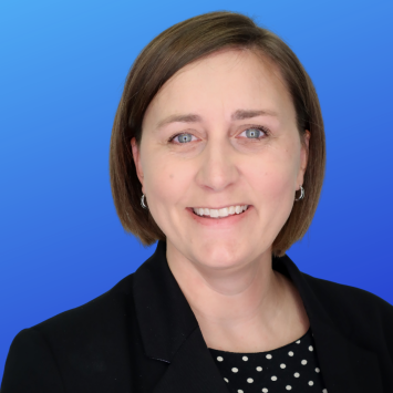 female short brown hair with dark blazer and polka dot top