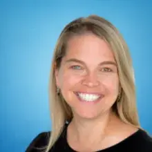 female with long blonde hair in a black shirt